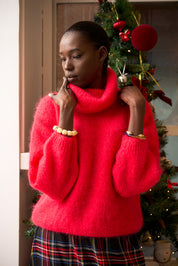 Suéter de cuello alto con margaritas